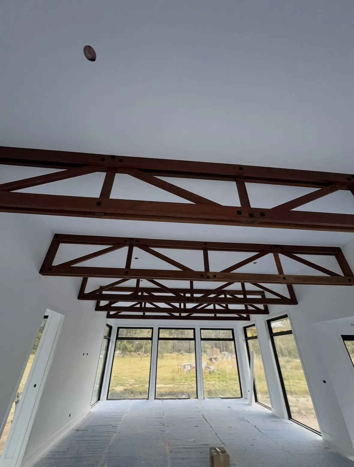 Lined interior with exposed timber trusses on a Summerfield Homes build