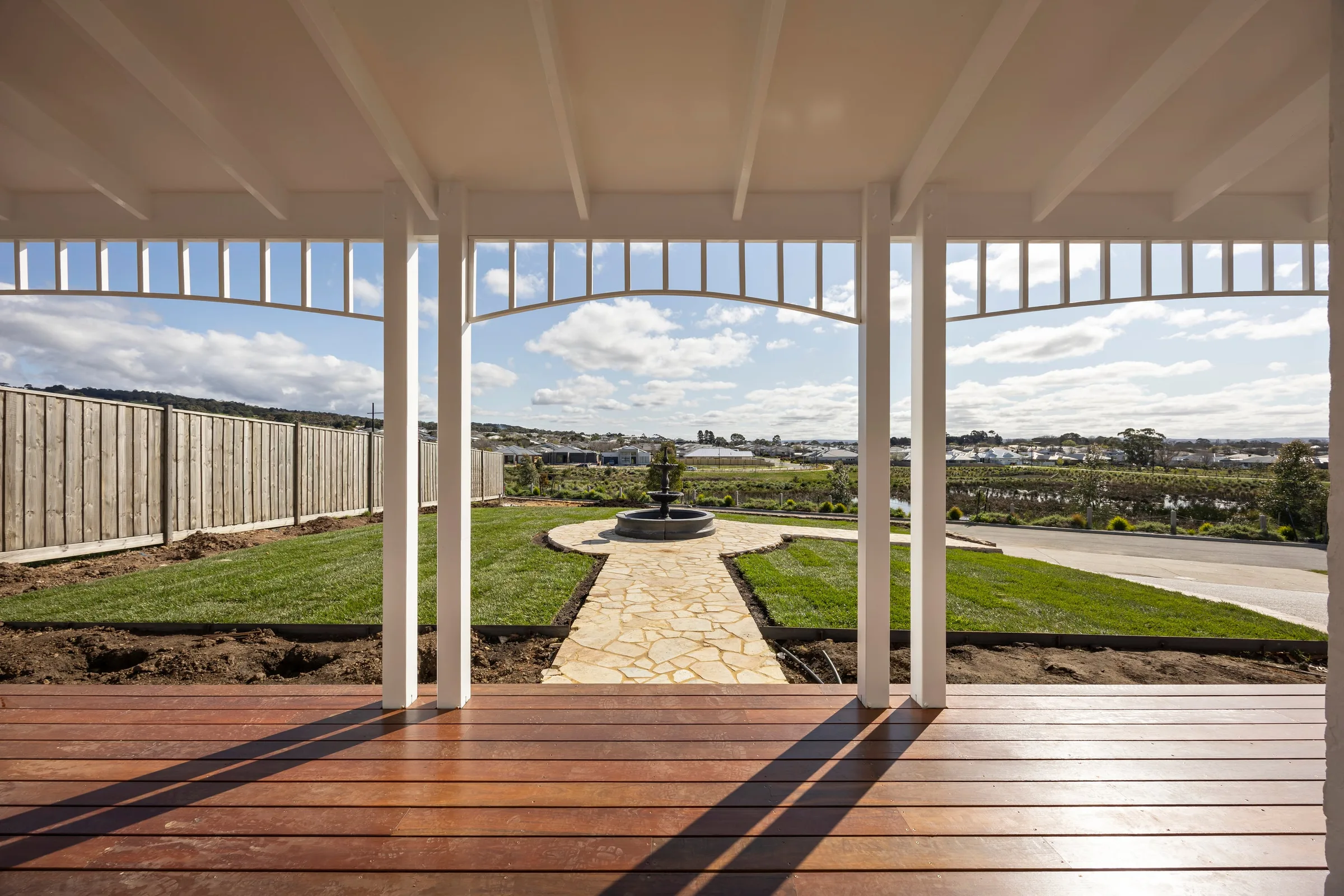 From under the verandah, the paved path running out to the fountain