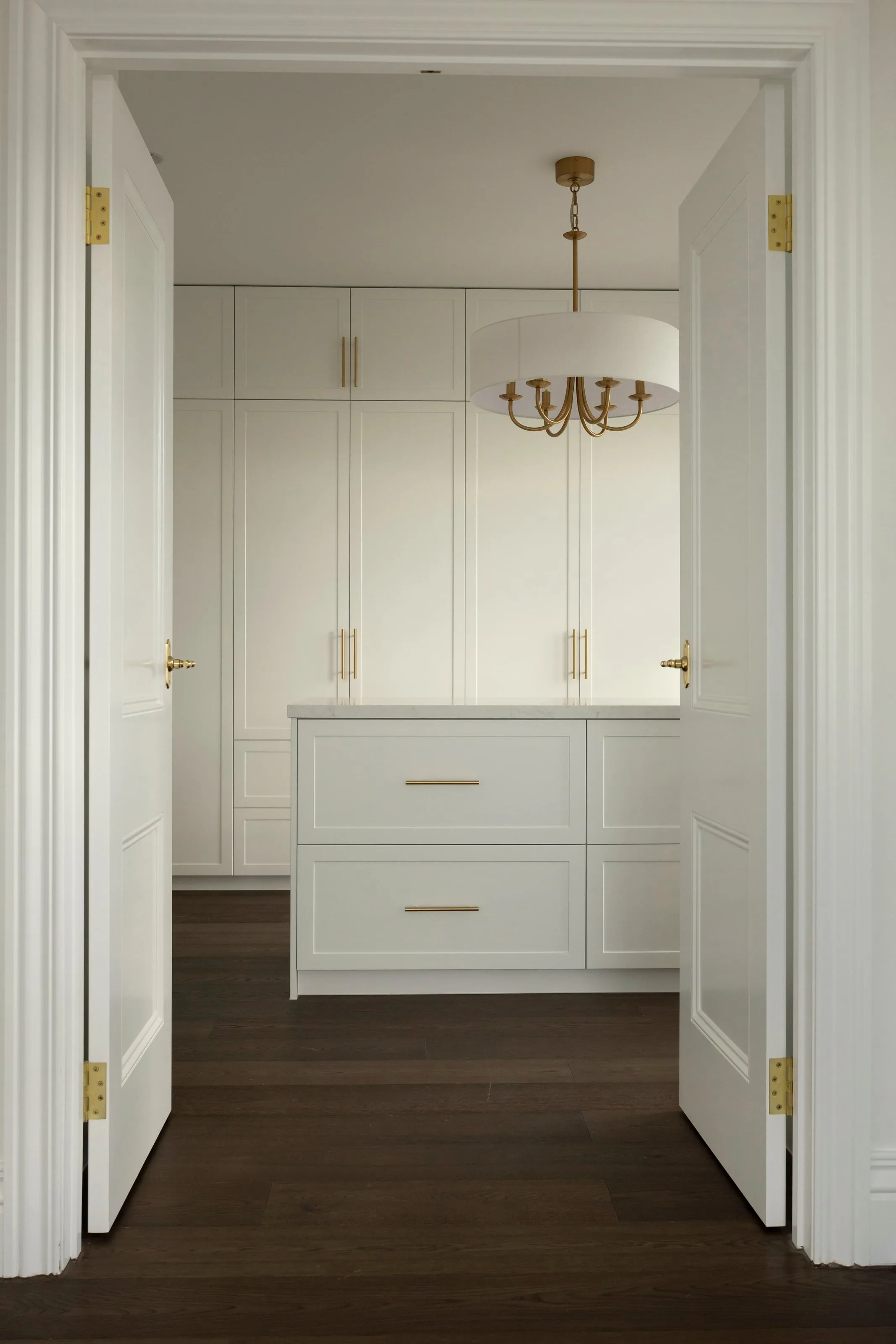 Through double doors into the walk-in robe