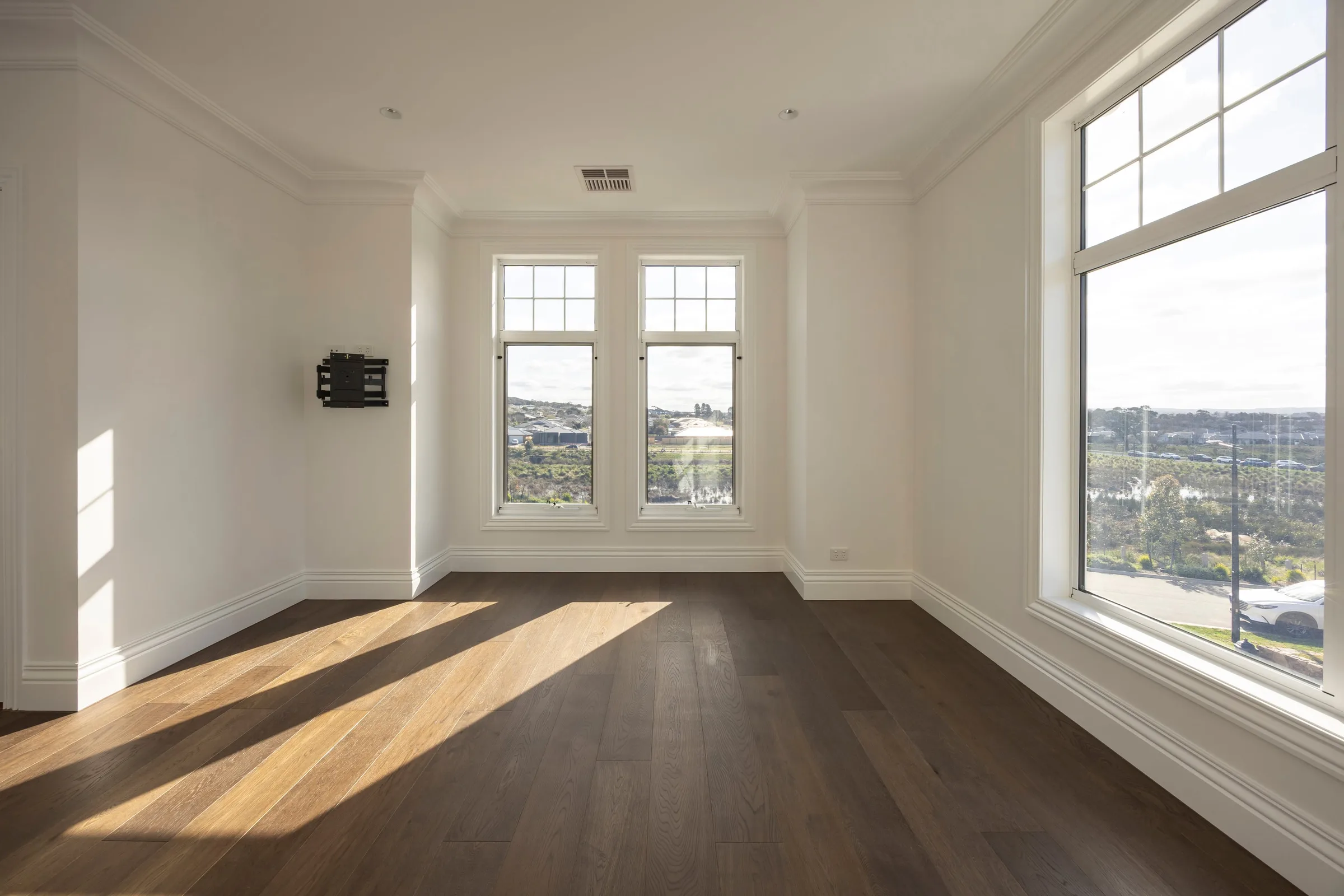 Upstairs bedroom with a large window over the estate