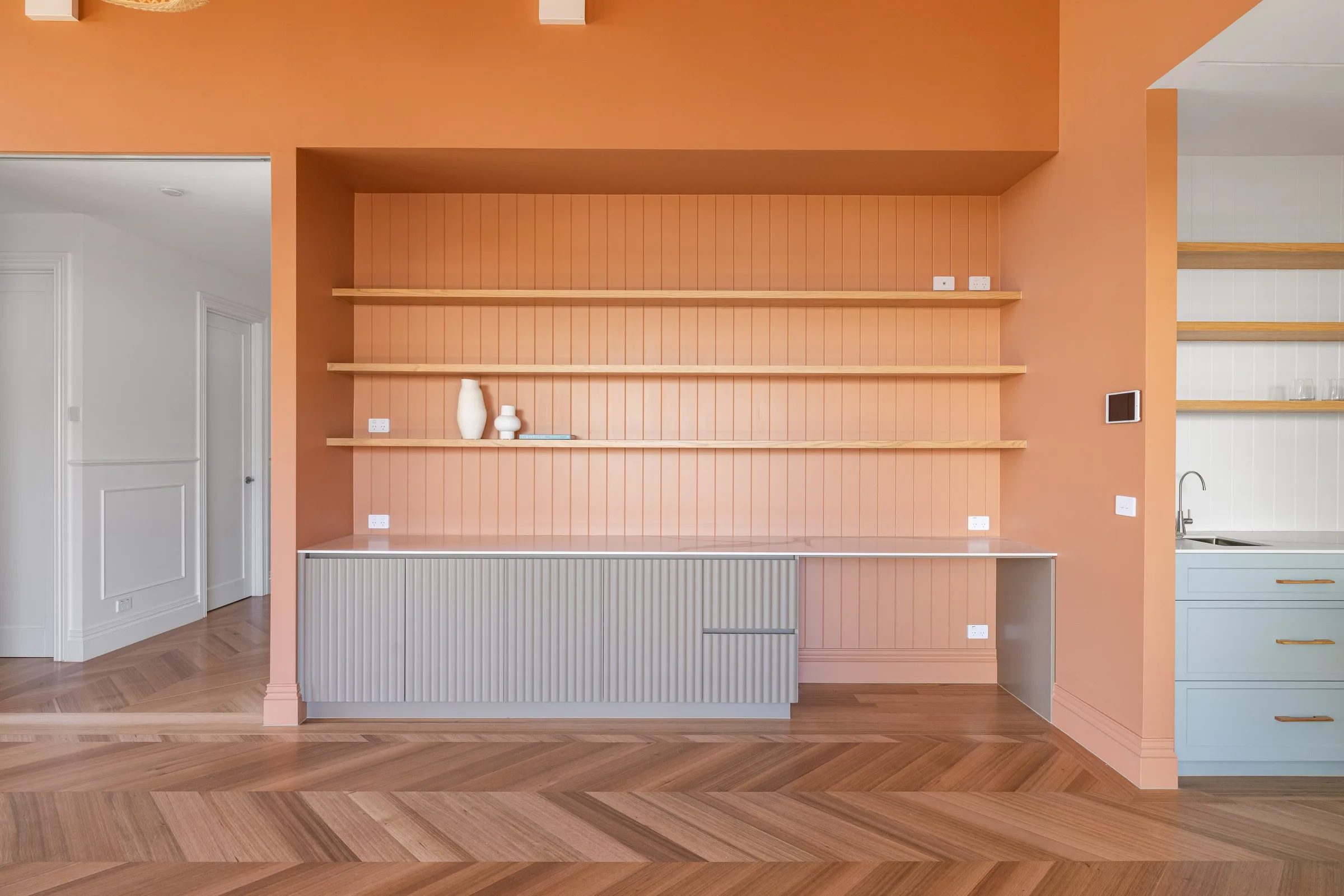 Built-in desk nook with blush VJ panelling, oak floating shelves and fluted pale grey joinery