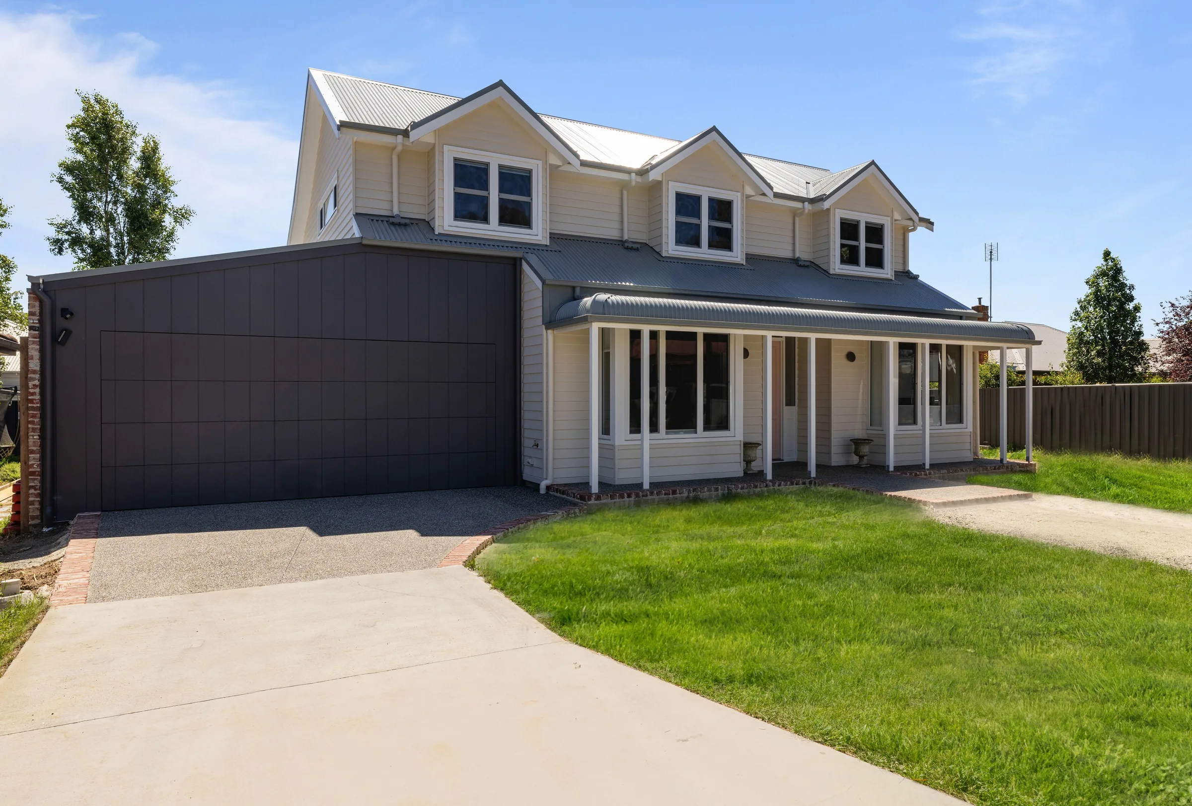 Warren St by Summerfield Homes &mdash; two-storey weatherboard home with dormer windows and a front verandah