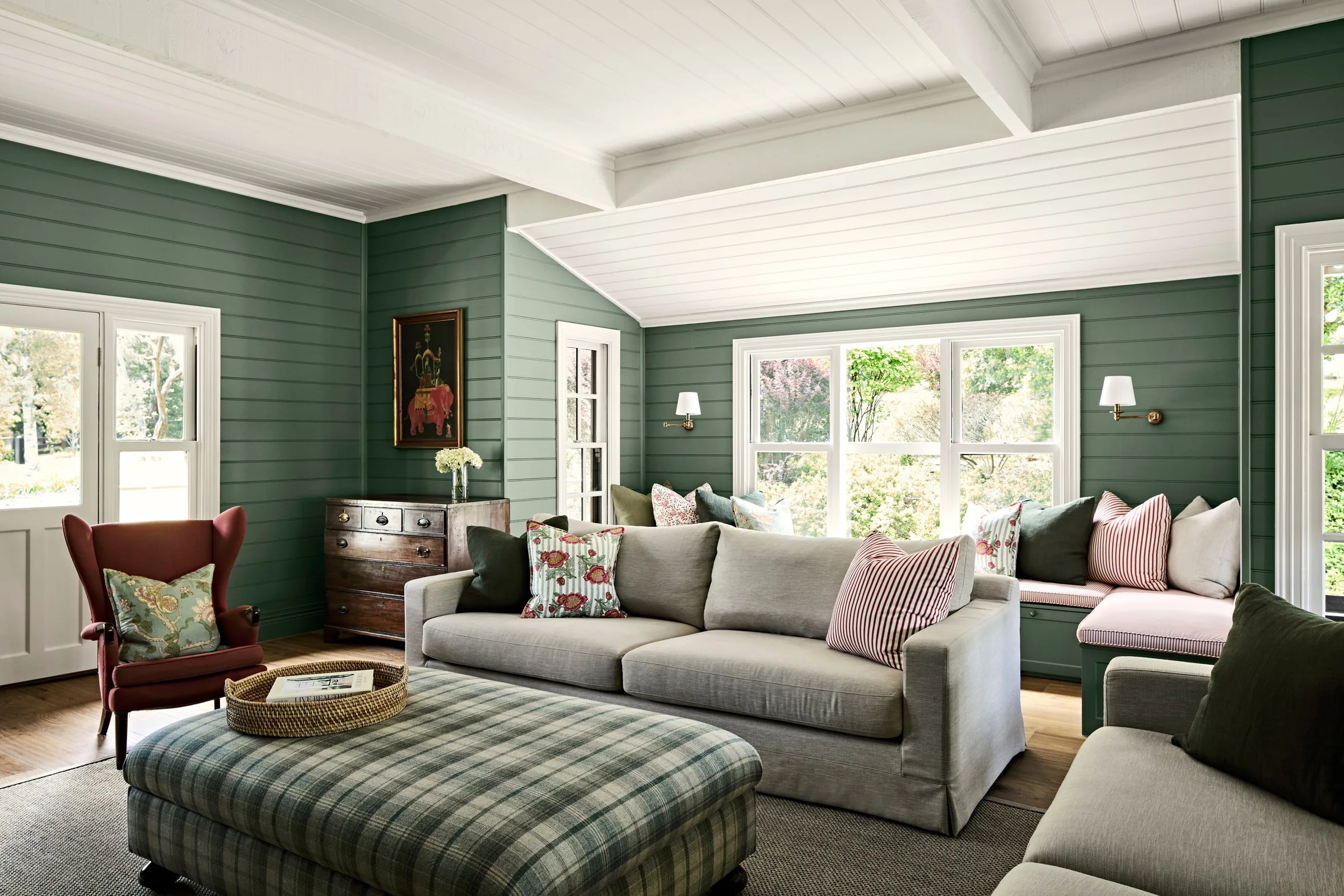 Green shiplap living room at Waterfalls Rd, window seat and white beamed ceiling